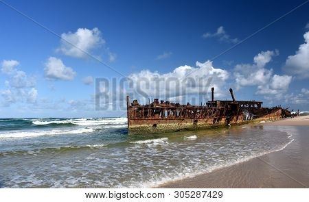 The Rusty Wreck Of The Vessel Maheno On The Shores Of Fraser Island (queensland, Australia). The Ant