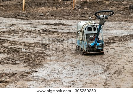 Plate Compactor On The Ground At Construction Site. Vibratory Hammer Power Tool, Jumping Jack Machin