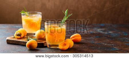 Summer Drinks, Rosemary Aprcot Cocktails With Ice In Glasses. Refreshing Summer Homemade Alcoholic O