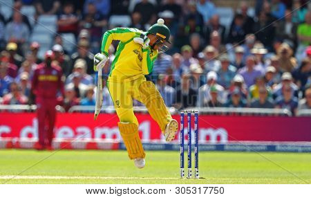 NOTTINGHAM, ENGLAND. 06 JUNE 2019:  Usman Khawaja of Australia gets hit in the head off the bowling of Oshane Thomas of West Indies  during the Australia against West Indies, ICC Cricket World Cup