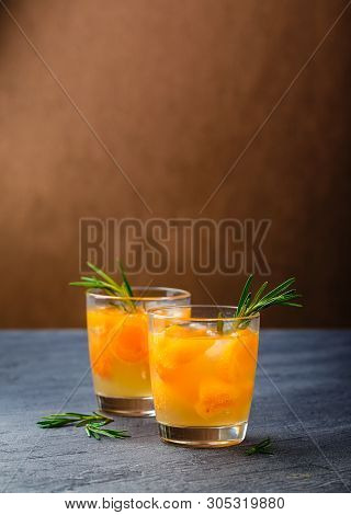 Summer Drinks, Rosemary Aprcot Cocktails With Ice In Glasses. Refreshing Summer Homemade Alcoholic O