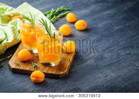 Summer Drinks, Rosemary Aprcot Cocktails With Ice In Glasses. Refreshing Summer Homemade Alcoholic O