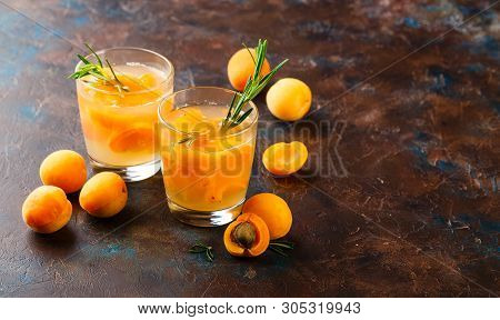Summer Drinks, Rosemary Aprcot Cocktails With Ice In Glasses. Refreshing Summer Homemade Alcoholic O