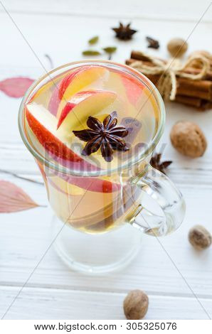 Autumn Mulled Wine Or Gluhwein Based On White Wine With Rum, Apple And Spices Cinnamon Sticks, Star 