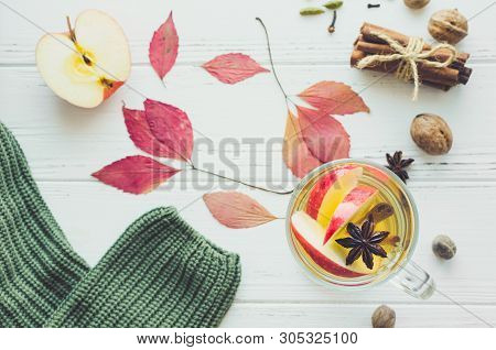 Autumn Mulled Wine Or Gluhwein Based On White Wine With Rum, Apple And Spices Cinnamon Sticks, Star 