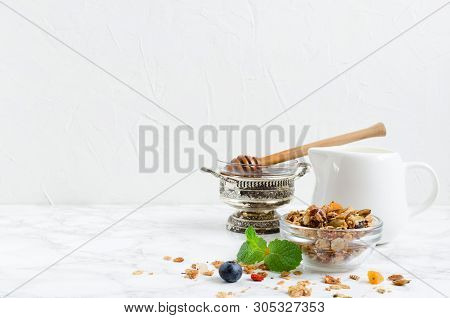 Delicious Homemade Granola In Glass Jar, Agave Nectar, Plant Milk And Fresh Blueberries. Healthy Pla