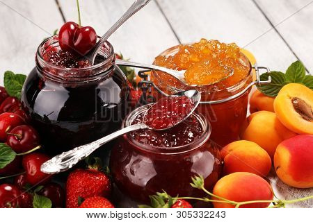Assortment Of Jams, Seasonal Berries, Apricot, Mint And Fruits. Marmalade Or Confiture