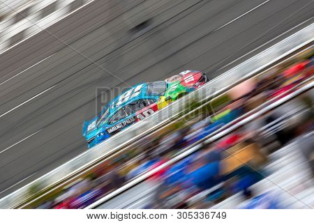 June 02, 2019 - Long Pond, Pennsylvania, USA: Kyle Busch (18) leads the field down the front stretch during the Pocono 400 at Pocono Raceway in Long Pond, Pennsylvania.