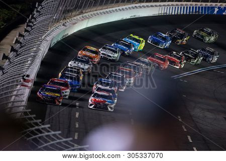 May 27, 2019 - Concord, North Carolina, USA: Kyle Busch (18) races off the turn during the Coca-Cola 600 at Charlotte Motor Speedway in Concord, North Carolina.