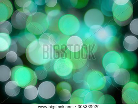 Greensand White Glowing Round Blurred Lights On A Black Background Abstract