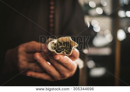 Tea master holding bowl with a tea