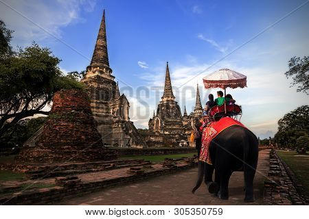Foreign Tourists Elephant Ride To Visit Ayutthaya, There Are Ruins And Temple In The Ayutthaya Perio
