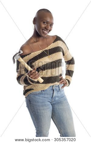 Black African American Female Model Holding A Hammer Repair Tool Looking Independent And Self Relian