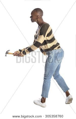 Black African American Female Swinging A Hammer Pretending To Hit Or Smash On A White Background.  S