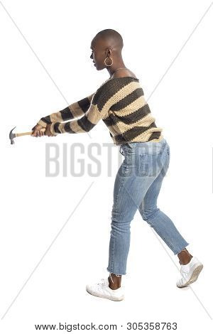 Black African American Female Swinging A Hammer Pretending To Hit Or Smash On A White Background.  S