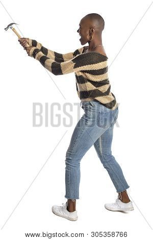 Black African American Female Swinging A Hammer Pretending To Hit Or Smash On A White Background.  S