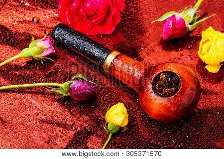 Smoking Pipe And Floral Tobacco
