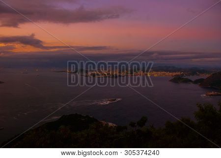 Rio De Janeiro, Brazil: Night View Of Copacabana Beach, Urca And Botafogo From Sugar Loaf In Rio De 