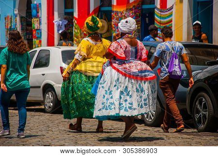Brazilian Woman Of African Descent, Smiling, Dressed In Traditional Baiana Attire In Pelourinho, Sal