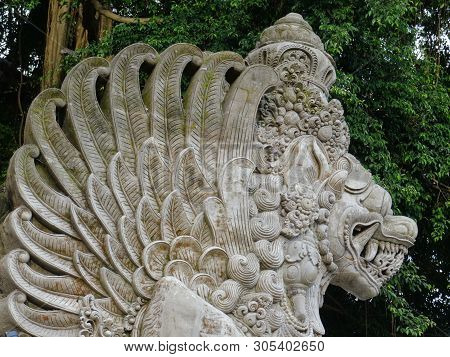 Close Up Picture Of A Traditional Balinese, Dragon Like, Stone Statue Located At The Entrance Of The