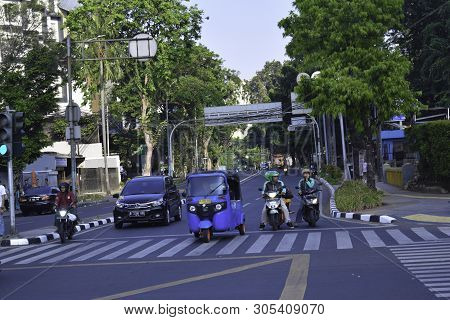 Jakarta,indonesia, June 8 2019 : The Motorcycle And Car Wait For Light Signal When It Show A Red Lig