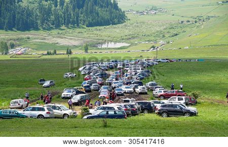 Sumuleu Ciuc, Romania- 08 June 2019: Parking Cars, Walking Pilgrims  During The Pentecostal Celebrat