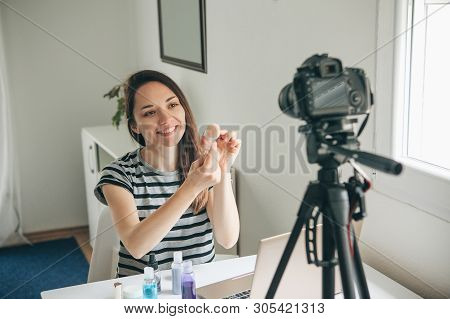 A Beauty Blogger Or Video Blogger Tells And Shows Subscribers How To Do Makeup.