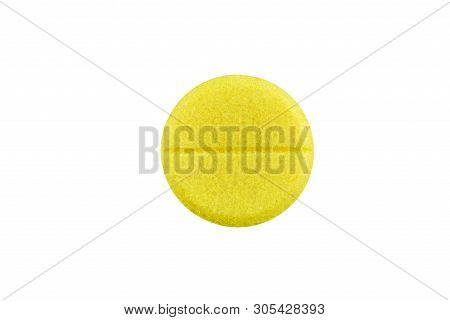 Macro Photo Of Yellow Pill. Isolated On White Background.