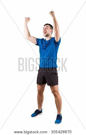 Full Length Portrait Of Young Man Athlete With Hands Raised, Celebrating Victory. Self Overcome Conc
