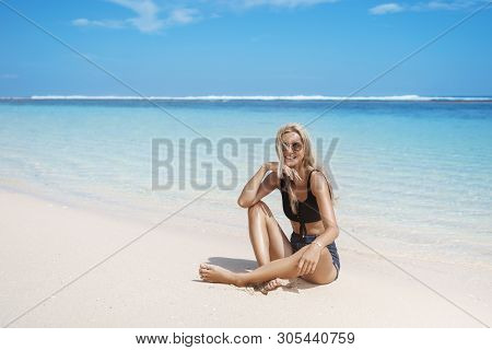 Alluring Happy Smiling Blond Tanned Female Tourist Enjoy Vacation Maldives, Paraside Islands Sit Cro