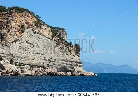 Rocks Near The Coast Of The Mediterranean Sea On A Background Of Mountains In Turkey