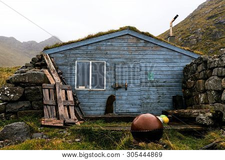 Blue Wooden Scandinavian Fishing And Hiking Cabin On Lofoten Islands In Norway (stokkvika)