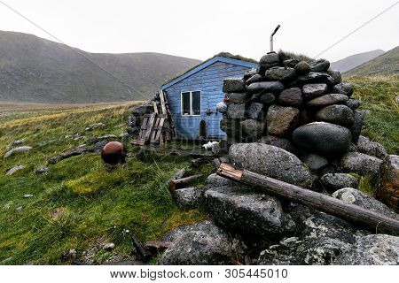 Blue Wooden Scandinavian Fishing And Hiking Cabin On Lofoten Islands In Norway (stokkvika)