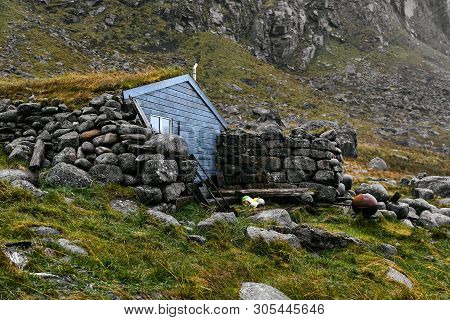 Blue Wooden Scandinavian Fishing And Hiking Cabin On Lofoten Islands In Norway (stokkvika)