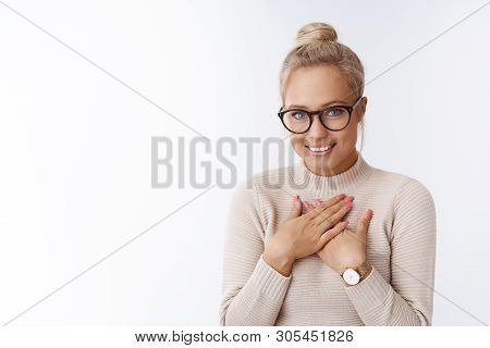 Shy And Cute Tender Young Attractive Blond Woman In Glasses Pressing Palms Heart In Appreciation Smi