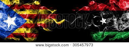 Catalonia Vs Libya, Libyan Smoke Flags Placed Side By Side. Thick Colored Silky Smoke Flags Of Catal