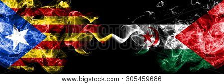 Catalonia Vs Sahrawi Smoke Flags Placed Side By Side. Thick Colored Silky Smoke Flags Of Catalonia A