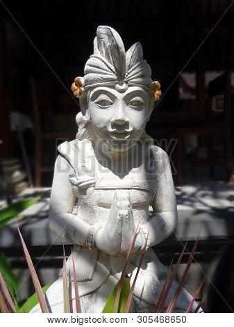 Sanur, Bali, Indonesia - 31th May 2018 : Beautiful White Stone Statue Of A Balinese Man, Captured In