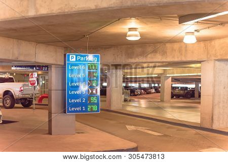 Smart Signboard With Available Spots For Each Level At Parking Garage In American Airport