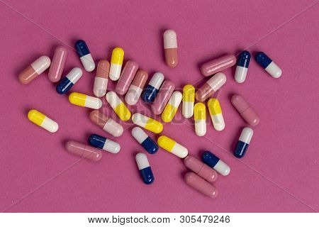 Various Colored Medical Capsules With White Microgranules