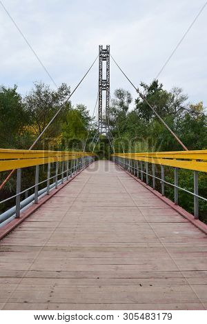 View Of The Hanging Mountain Bridge With Yellow Railings And Taut Cables Across The River On Mount K