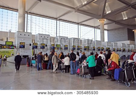 Malaga, Spain - March 16 2010 - Passengers Waiting To Check In For Flights In Terminal Three Departu
