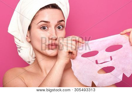 Portrait Of Half Naked Cute Young Woman With White Towel On Her Head, Looking Directly At Camera, Sh