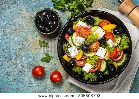 Greek Salad. Vegetable Salad From Tomato, Cucumber, Feta Cheese And Olive Oil. Mediterranean Kitchen