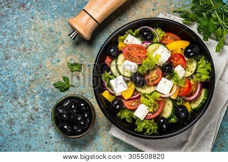 Greek Salad. Vegetable Salad From Tomato, Cucumber, Feta Cheese And Olive Oil. Mediterranean Kitchen