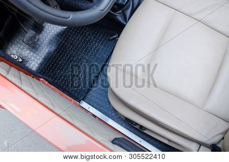 Transportation Interio From The Top View. White Leather Front Seat Of The Car With Black Steering Wh