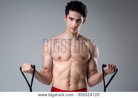 Studio Portrait Young Caucasian Man On Gray Background Posing. Theme Of Puberty, Problem Skin, Teen 