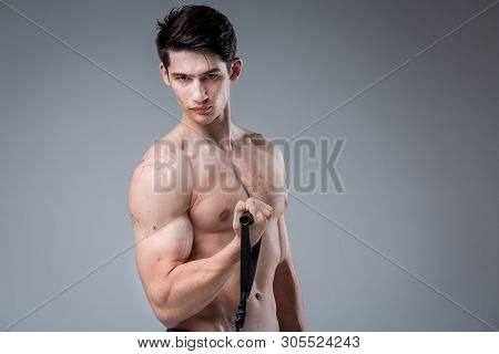 Studio Portrait Young Caucasian Man On Gray Background Posing. Theme Of Puberty, Problem Skin, Teen 