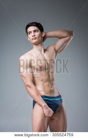 Studio Portrait Young Caucasian Man On Gray Background Posing. Theme Of Puberty, Problem Skin, Teen 