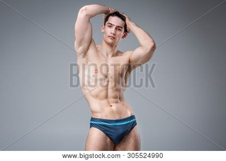 Studio Portrait Young Caucasian Man On Gray Background Posing. Theme Of Puberty, Problem Skin, Teen 